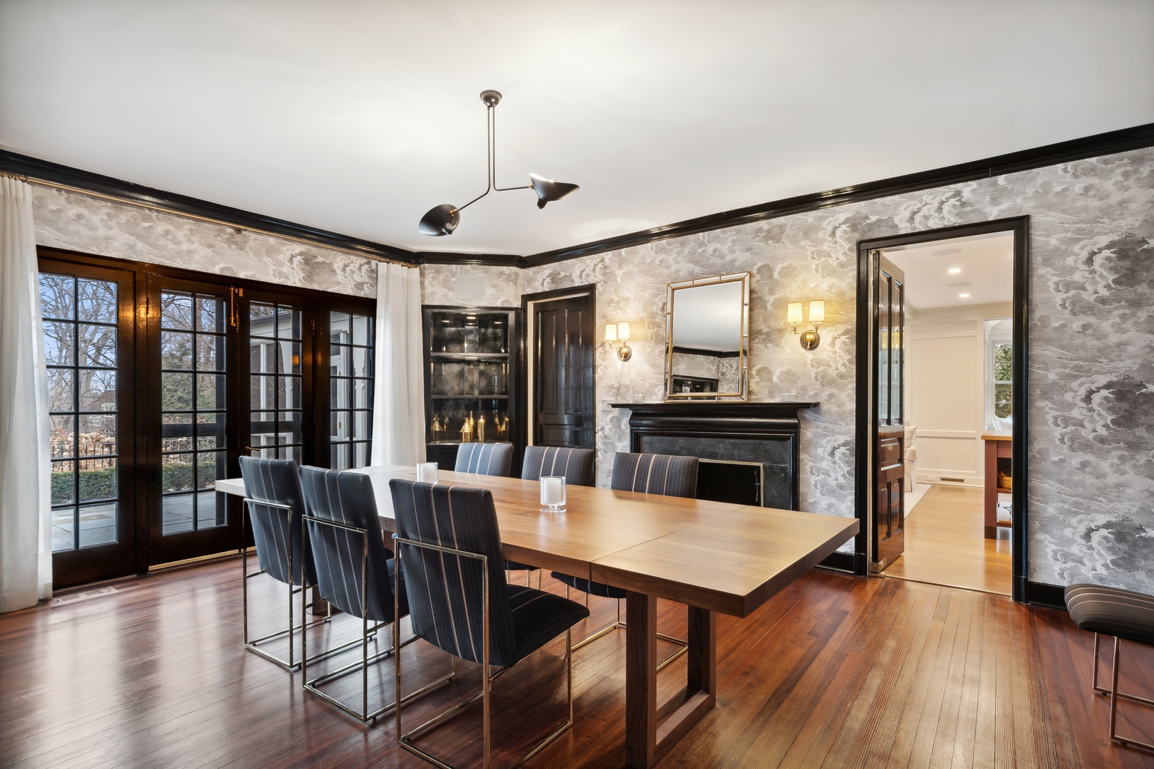 1296 North Green Bay Road Lake Forest, IL 60045 - Photo 21 of 69 a kitchen with granite countertop a table chairs stainless steel appliances and wooden floor