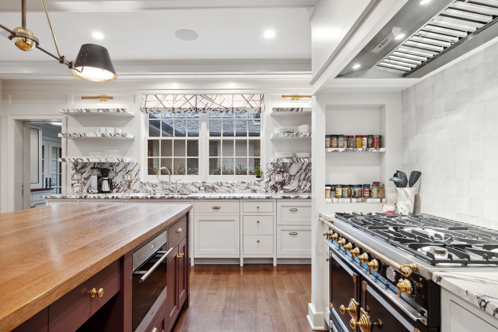 1296 North Green Bay Road Lake Forest, IL 60045 - Photo 25 of 69 a kitchen with sink stove and cabinets
