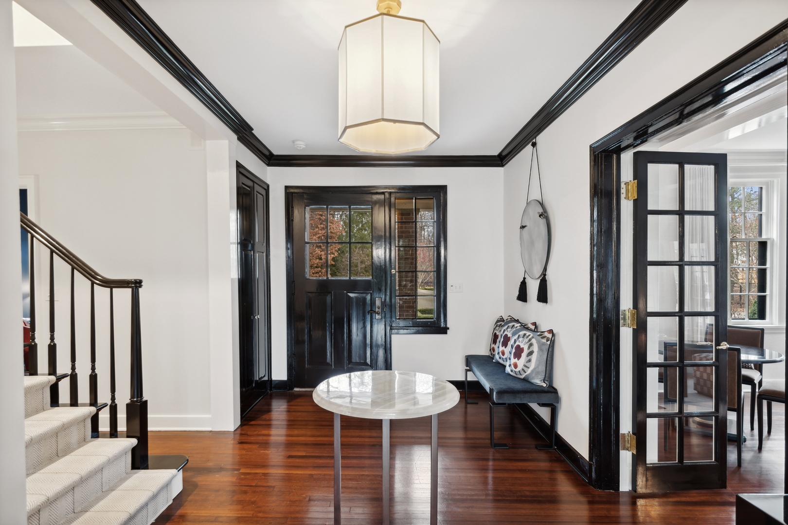 1296 North Green Bay Road Lake Forest, IL 60045 - Photo 4 of 69 a front view with a large mirror and wooden floor