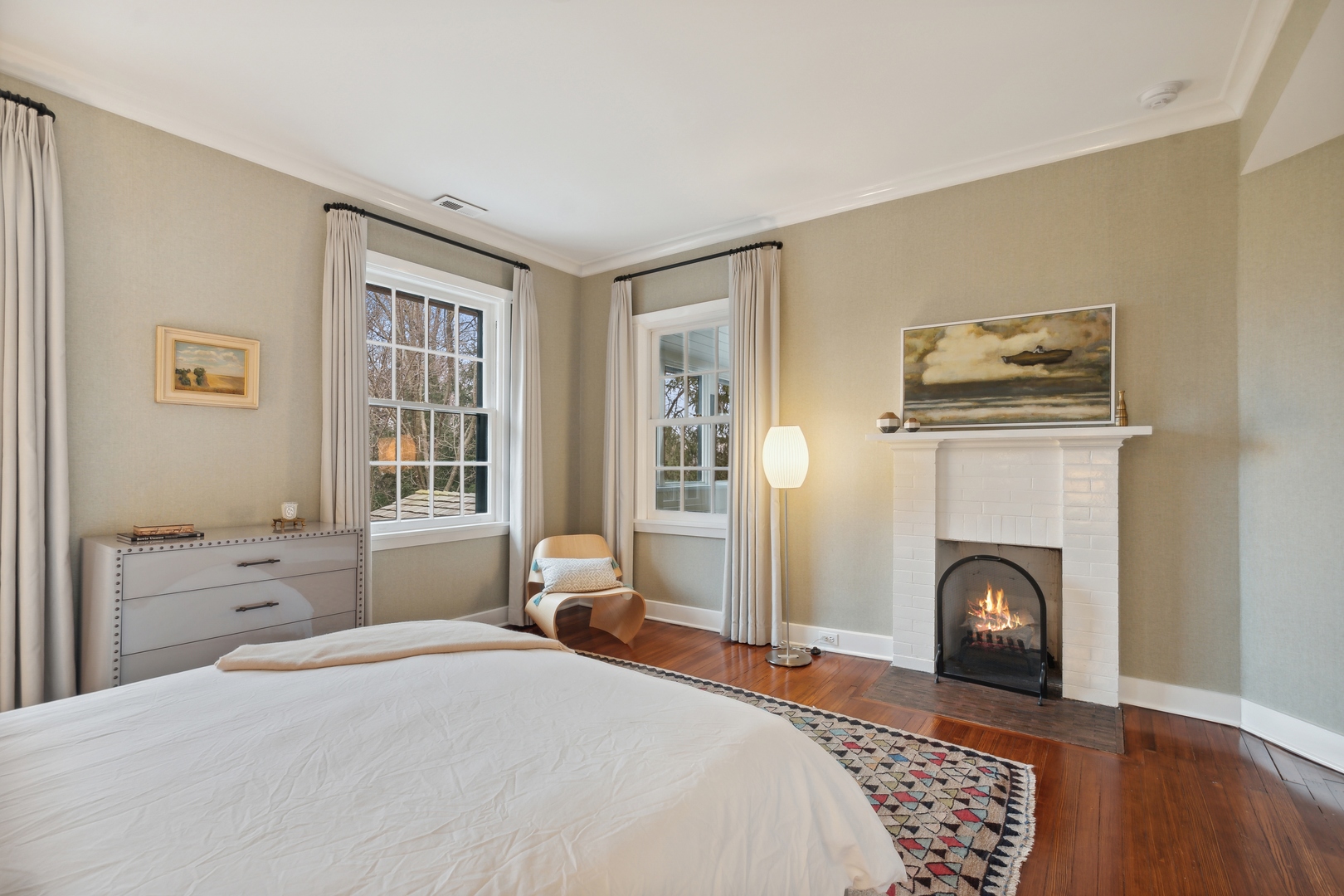 1296 North Green Bay Road Lake Forest, IL 60045 - Photo 44 of 69 a bedroom with a bed and a fireplace