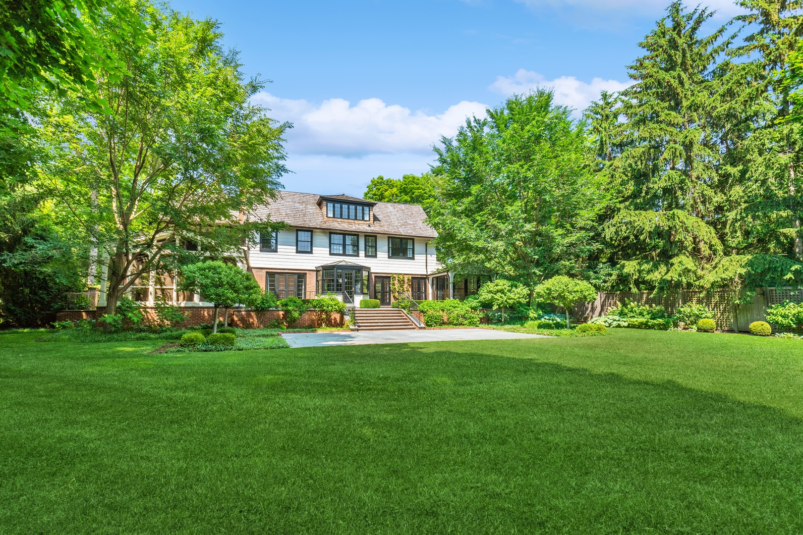 1296 North Green Bay Road Lake Forest, IL 60045 - Photo 64 of 69 a front view of a house with a garden