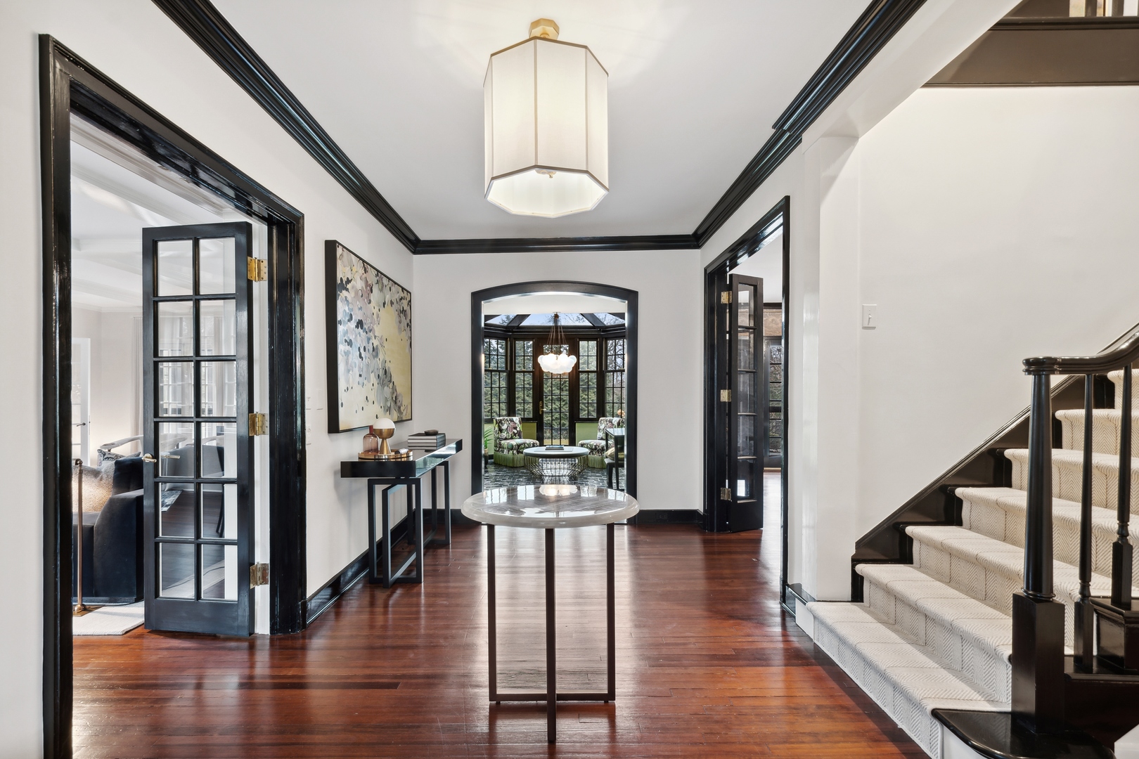 1296 North Green Bay Road Lake Forest, IL 60045 - Photo 9 of 69 a view of a hallway with wooden floor and furniture