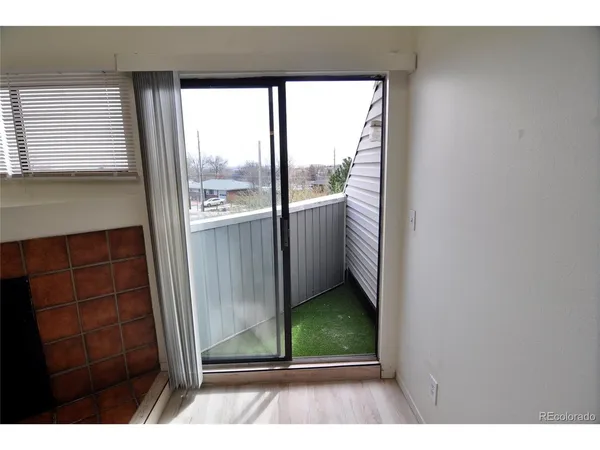 a view of a door and a window