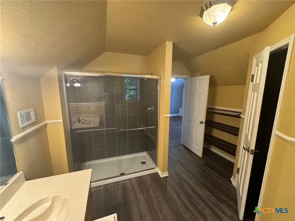 a bathroom with a tub and a shower