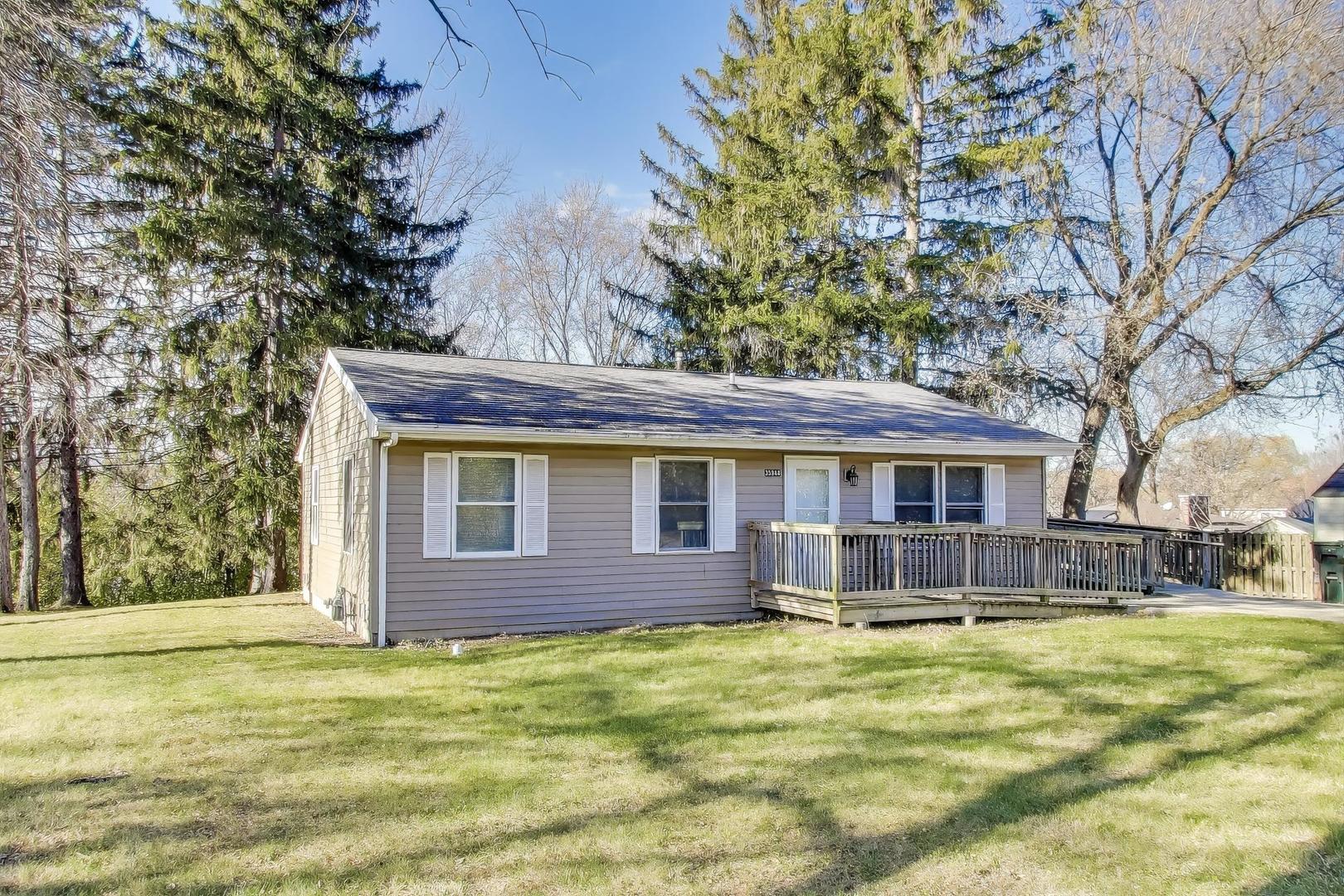 35944 North Wilson Road Ingleside, IL 60041 - Photo 3 of 26 a front view of a house with a garden