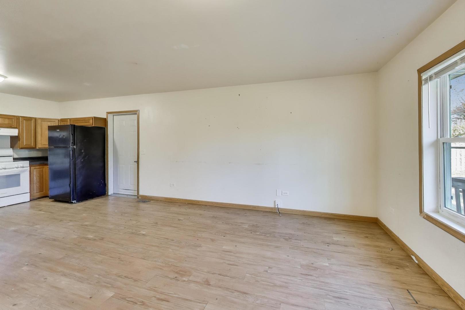 35944 North Wilson Road Ingleside, IL 60041 - Photo 4 of 26 a view of an empty room with a window
