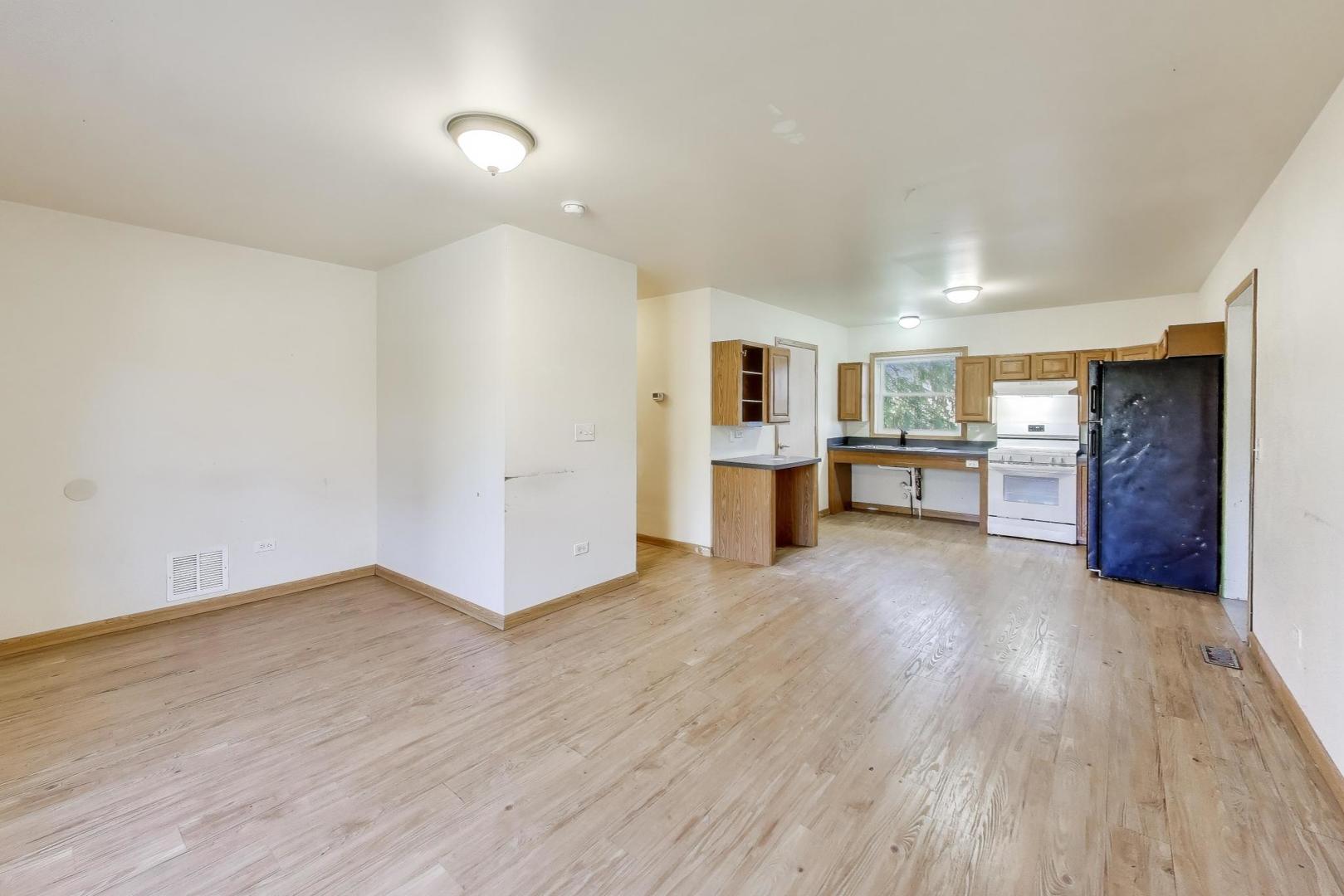35944 North Wilson Road Ingleside, IL 60041 - Photo 5 of 26 a view of a kitchen with a sink and a refrigerator