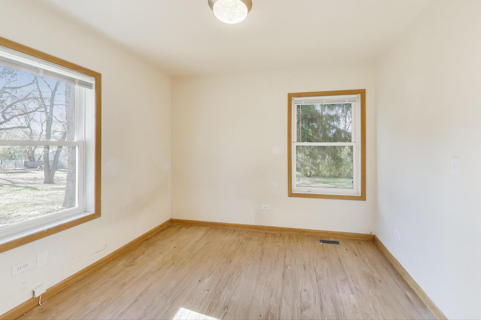 35944 North Wilson Road Ingleside, IL 60041 - Photo 9 of 26 wooden floor in an empty room with a window