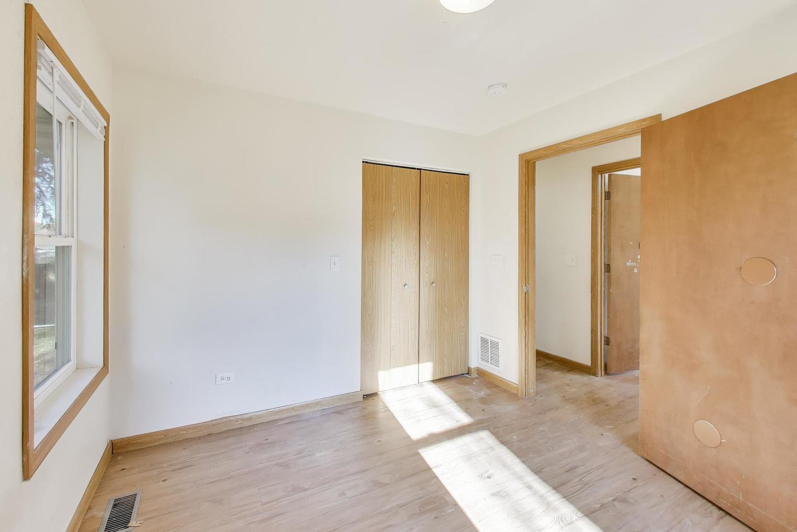 35944 North Wilson Road Ingleside, IL 60041 - Photo 10 of 26 a view of an empty room with wooden floor and a window