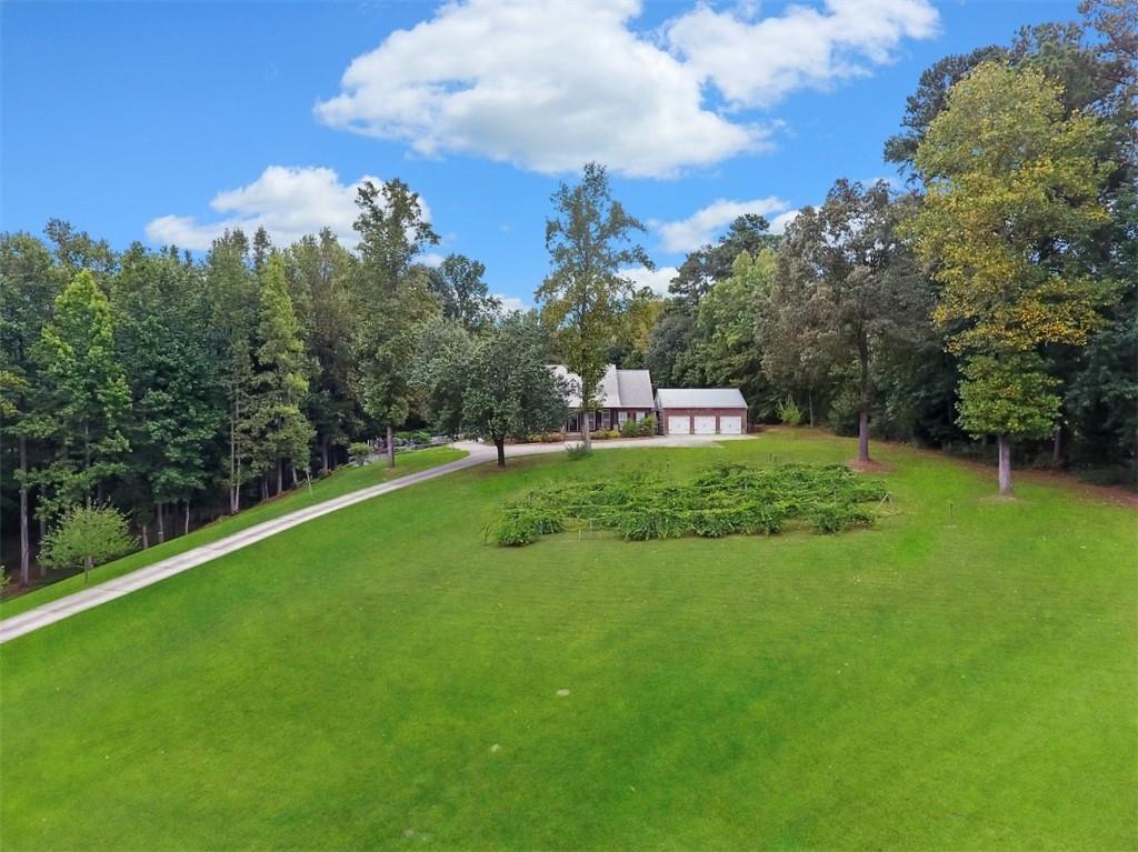 STELLAR 6 BEDROOM, 5.5 BATH HOME SITS ON A BEAUTIFUL, SELF-SUSTAINING 7 ACRES