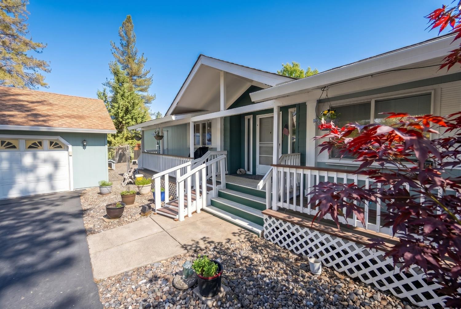 4360 Pleasant Valley Road Placerville, CA 95667 - Photo 35 of 71 a view of a house with wooden deck and furniture