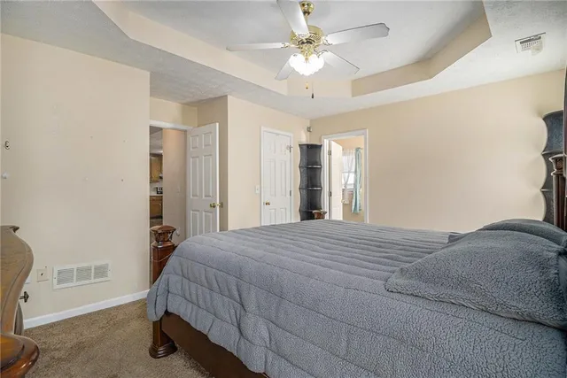 a bedroom with a bed and a chair