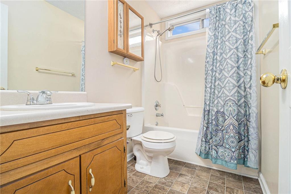 40 Willow Tree Terrace Covington, GA 30016 - Photo 24 of 32 a bathroom with a sink toilet and shower