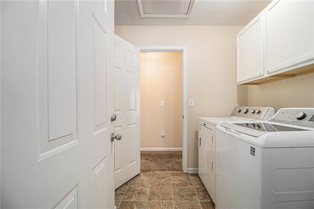 40 Willow Tree Terrace Covington, GA 30016 - Photo 25 of 32 a utility room with dryer and washer