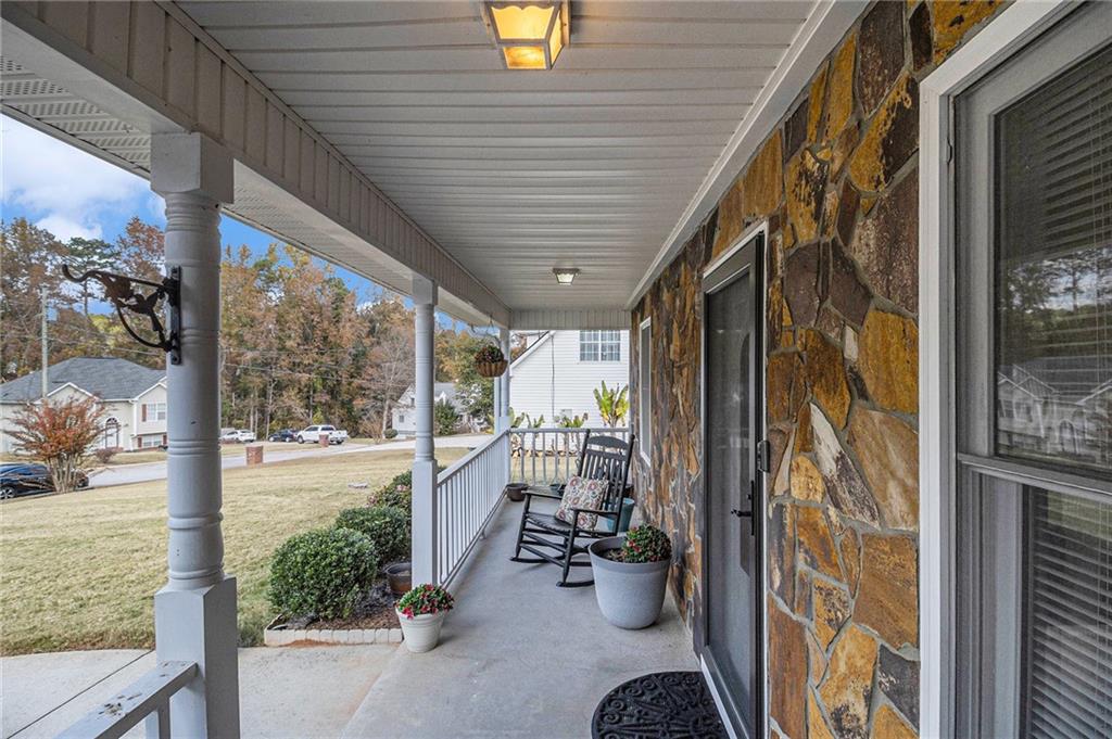 40 Willow Tree Terrace Covington, GA 30016 - Photo 4 of 32 a view of a porch with furniture
