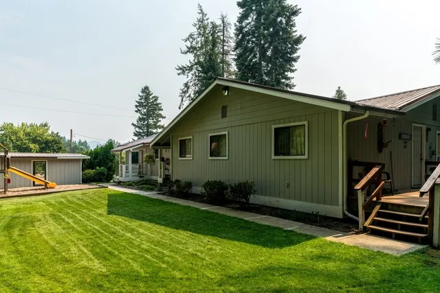 a backyard of a house with seating space