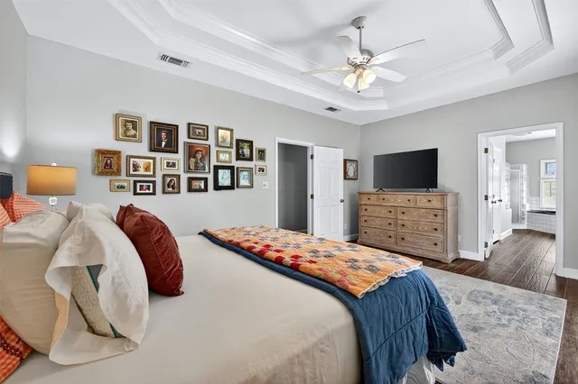 a bedroom with a bed and a television