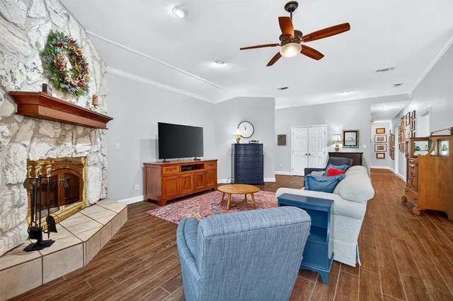 a living room with furniture and a fireplace