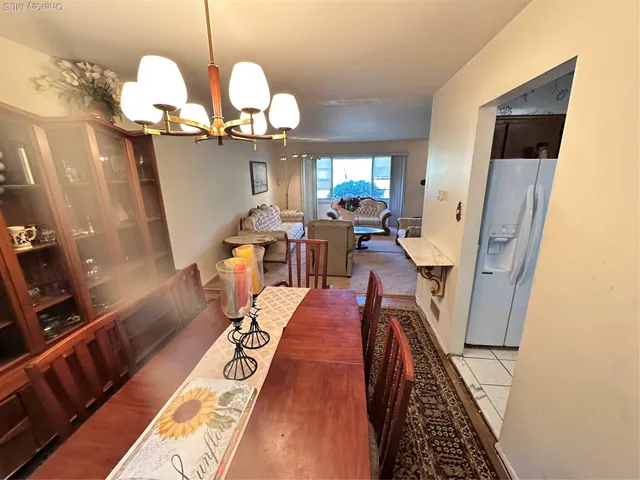 a very nice looking dining room with wooden floor
