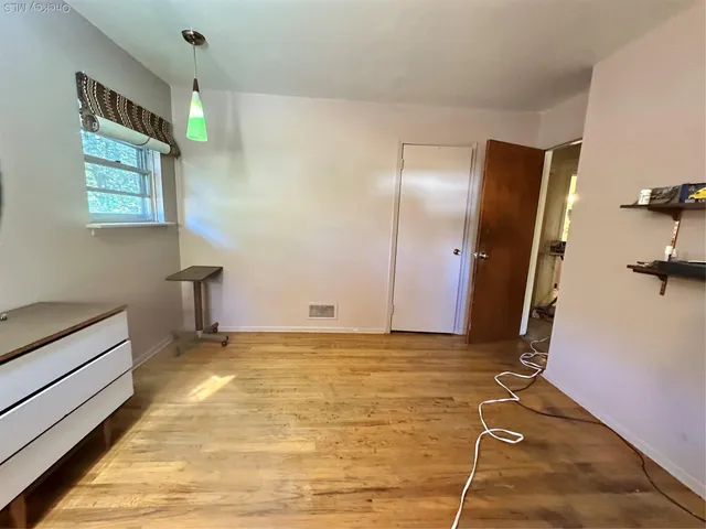 a view of room with window and stairs