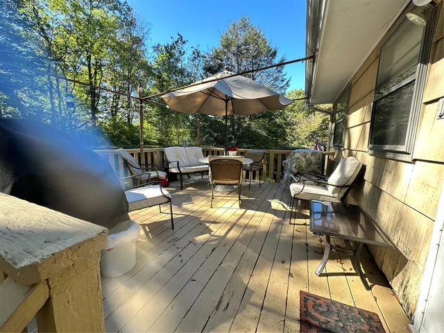 swimming pool view with a seating space