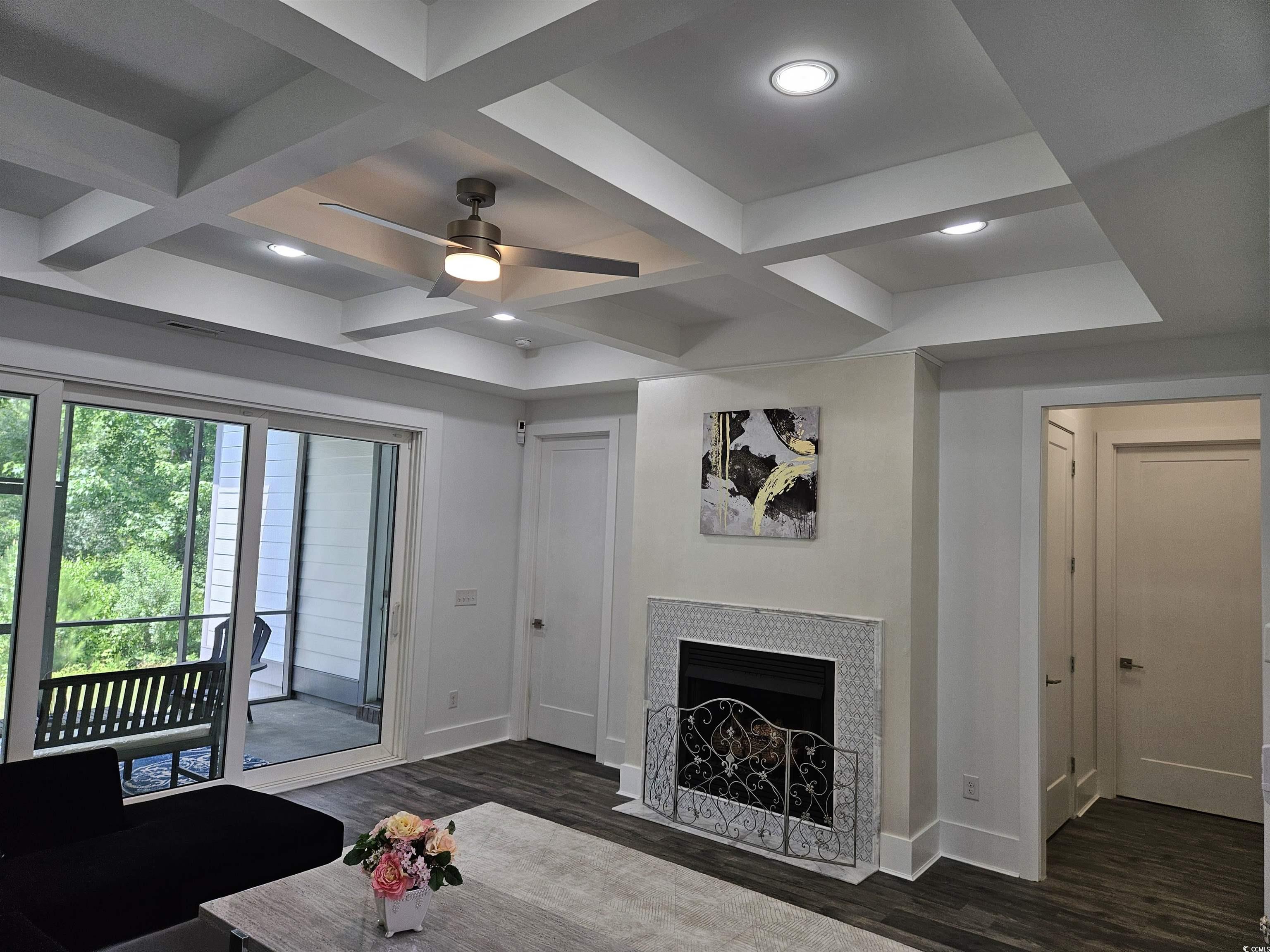 218 Rivers Edge Drive Conway, SC 29526 - Photo 15 of 40 Living room featuring coffered ceiling, beamed cei