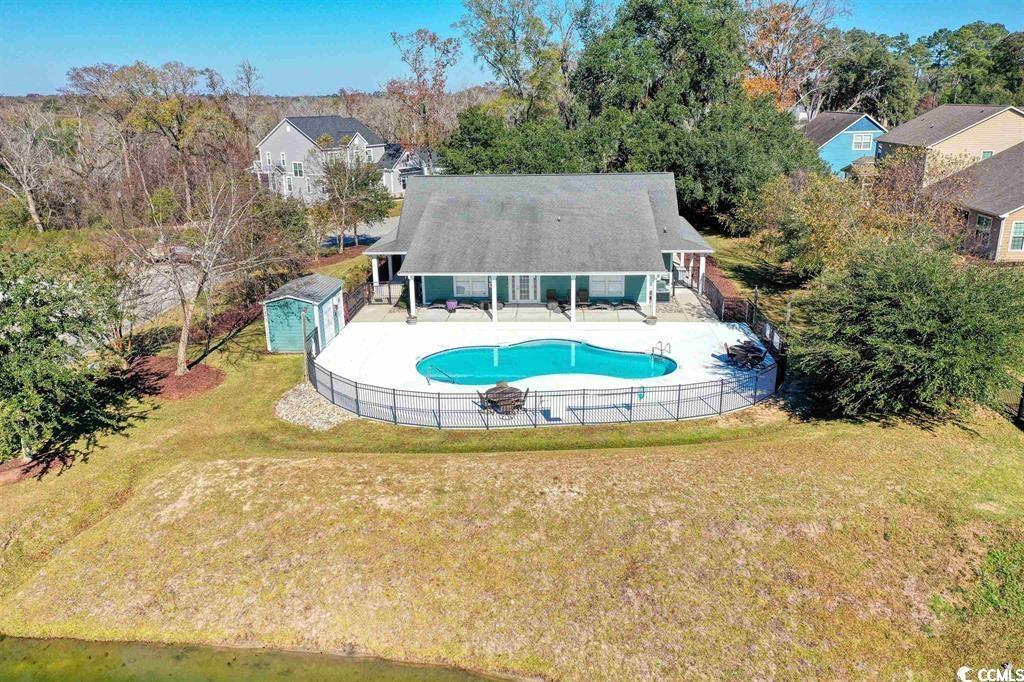 218 Rivers Edge Drive Conway, SC 29526 - Photo 40 of 40 View of pool featuring a storage unit, a yard, and