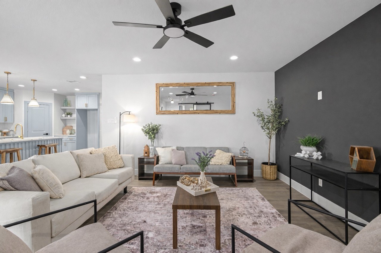 5420 Pease Street Houston, TX 77023 - Photo 2 of 43 a living room with furniture and a chandelier