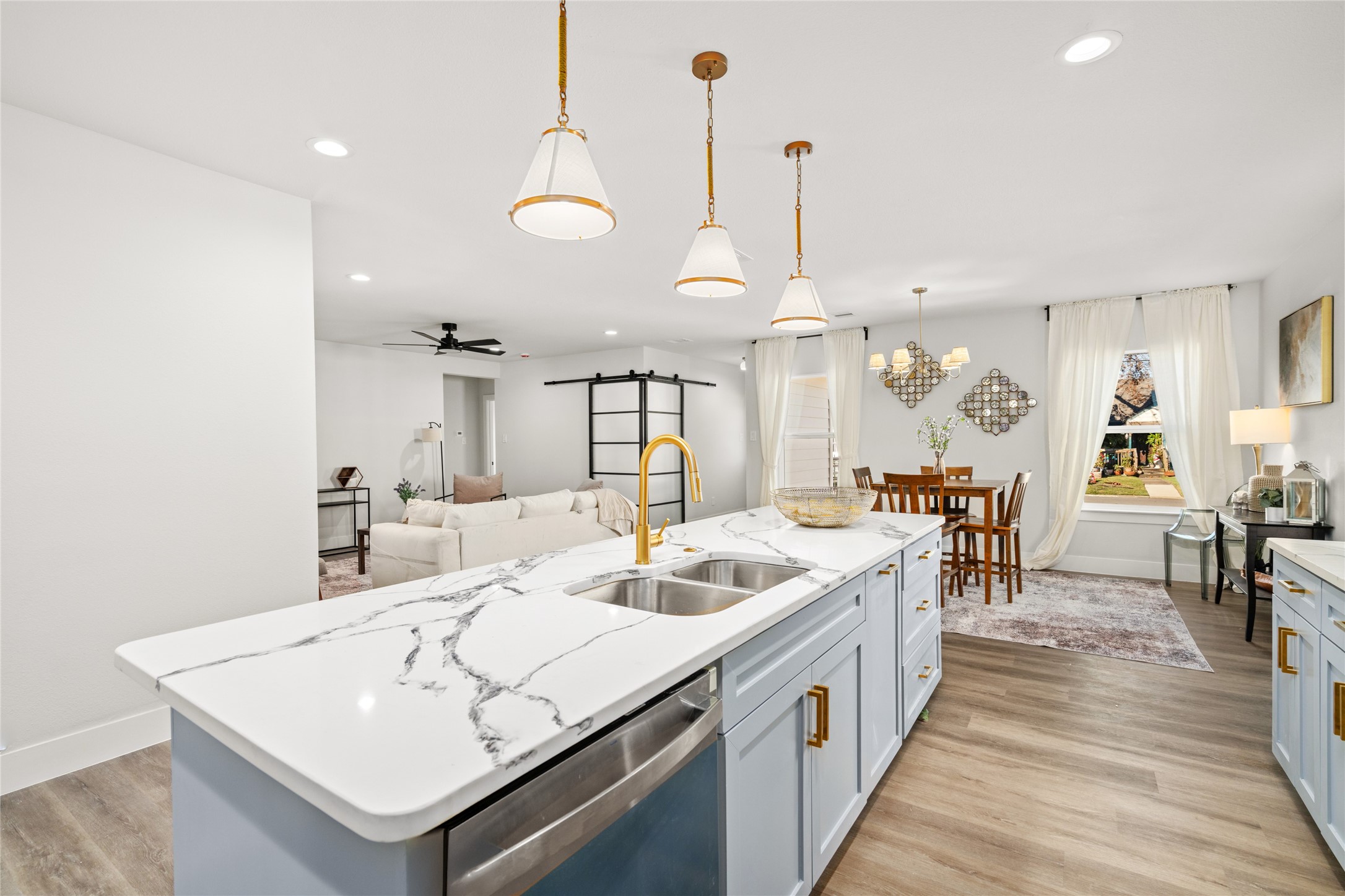 5420 Pease Street Houston, TX 77023 - Photo 21 of 43 a large white kitchen with a large island