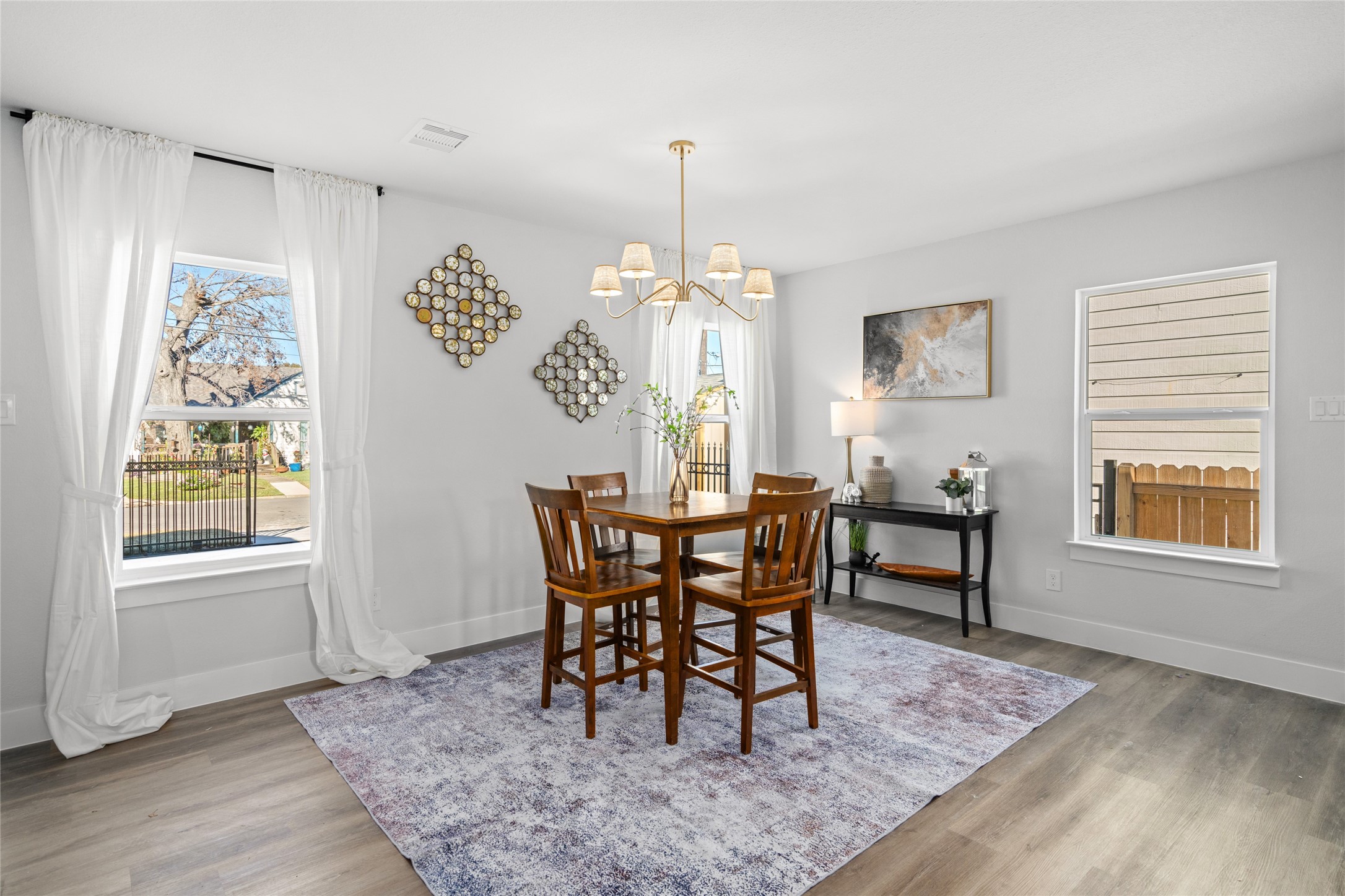 5420 Pease Street Houston, TX 77023 - Photo 22 of 43 a view of a dining room with furniture window and wooden floor