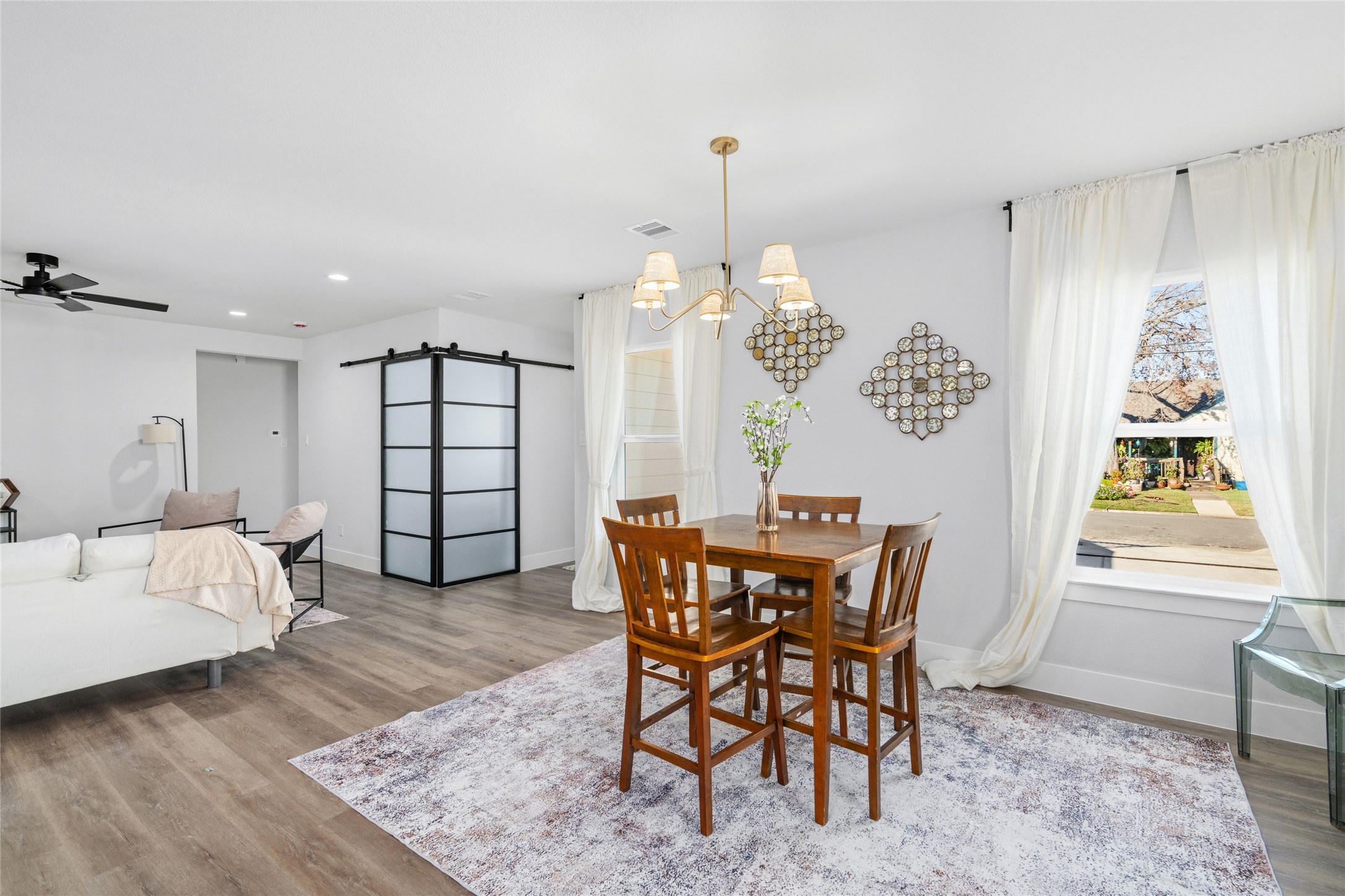 5420 Pease Street Houston, TX 77023 - Photo 23 of 43 a view of a dining room with furniture window and wooden floor