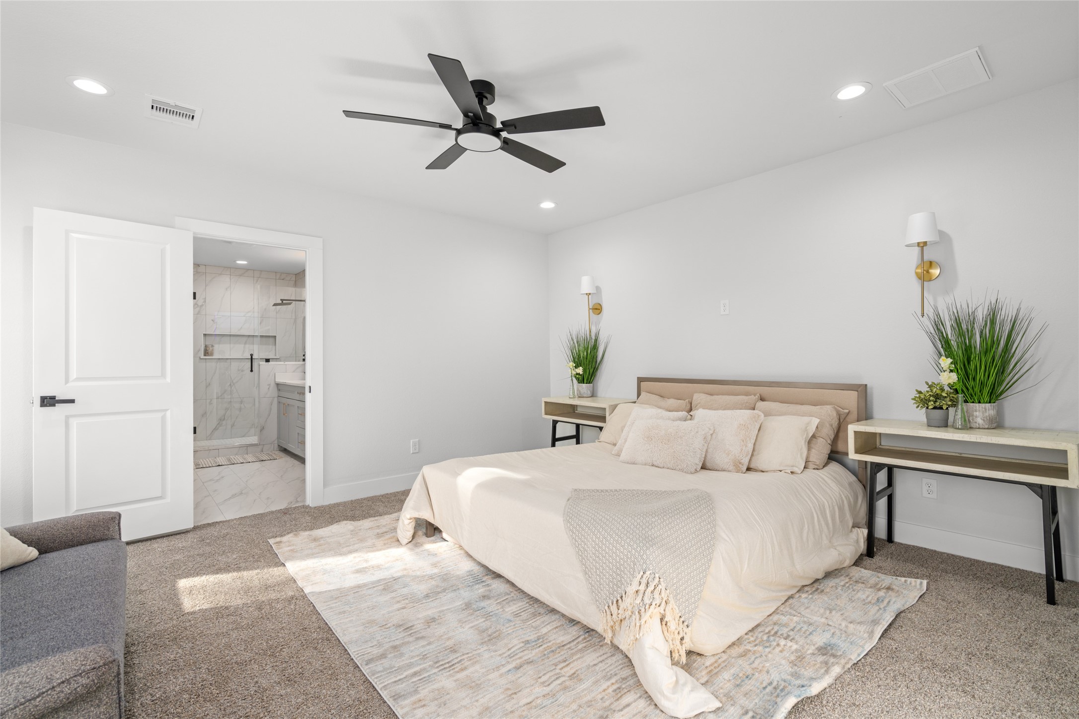 5420 Pease Street Houston, TX 77023 - Photo 30 of 43 a bedroom with a large bed and a chandelier