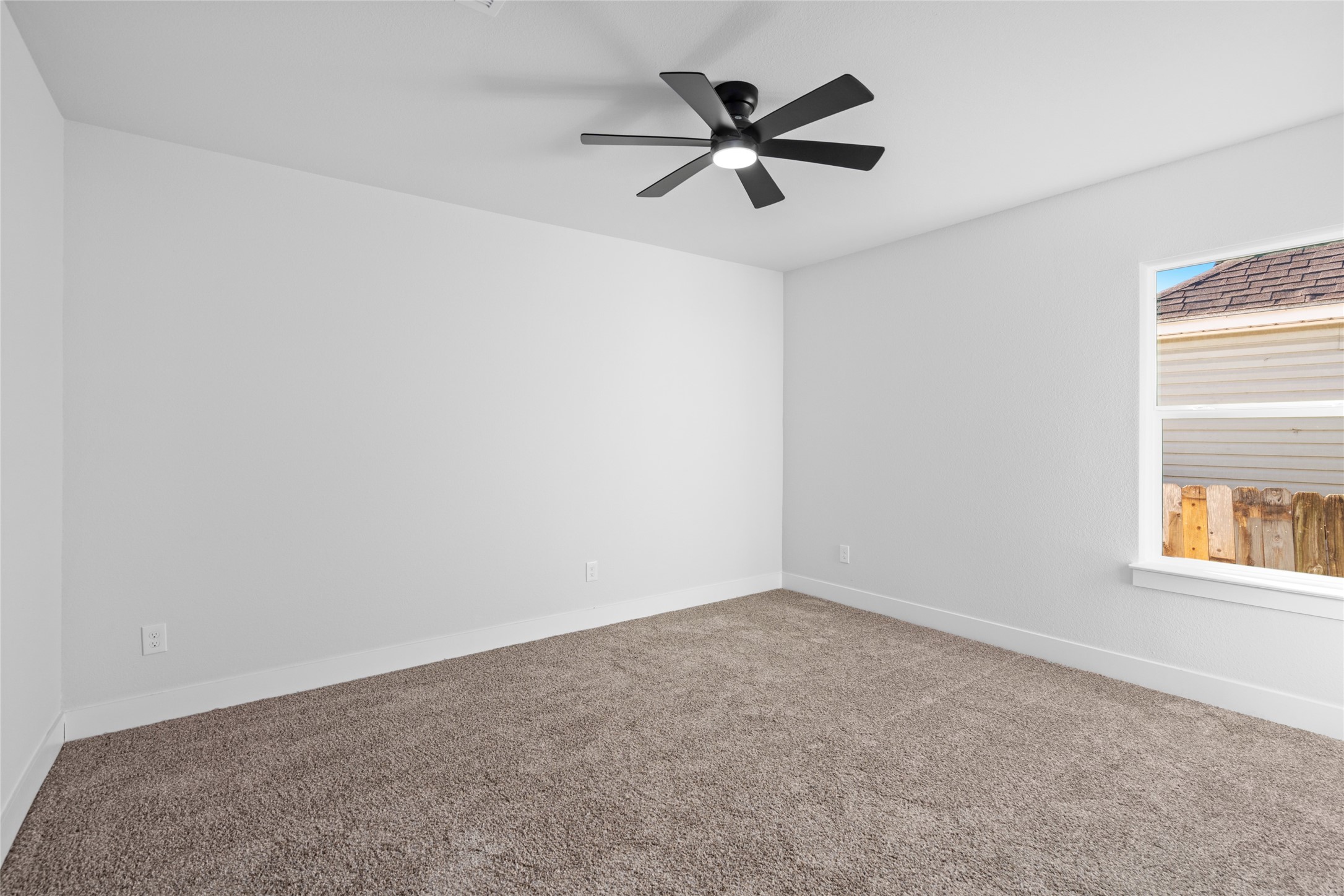 5420 Pease Street Houston, TX 77023 - Photo 33 of 43 an empty room with a window and a fan