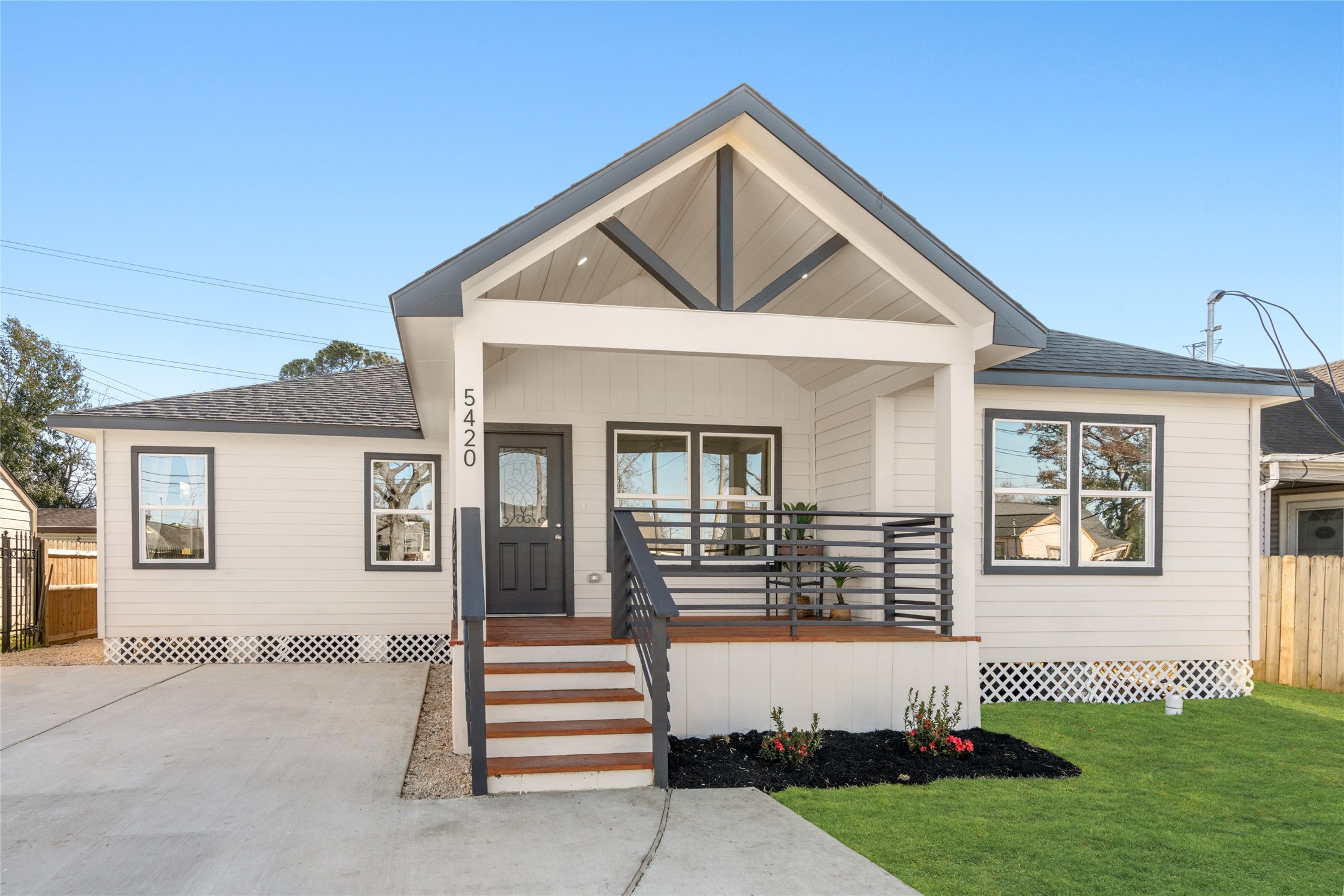 5420 Pease Street Houston, TX 77023 - Photo 7 of 43 a front view of a house with a yard