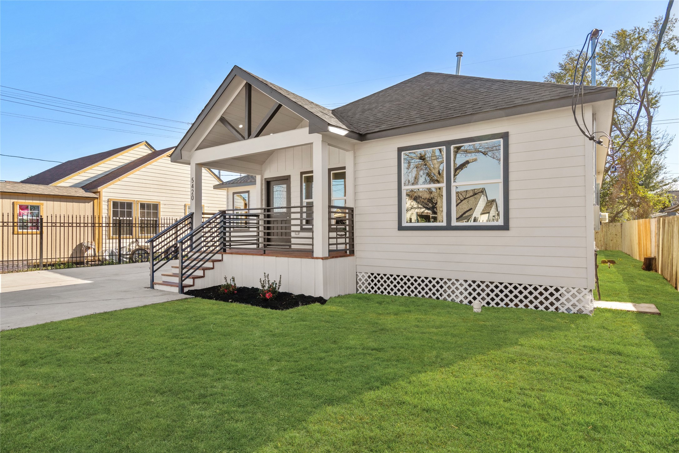 5420 Pease Street Houston, TX 77023 - Photo 8 of 43 a front view of a house with a garden