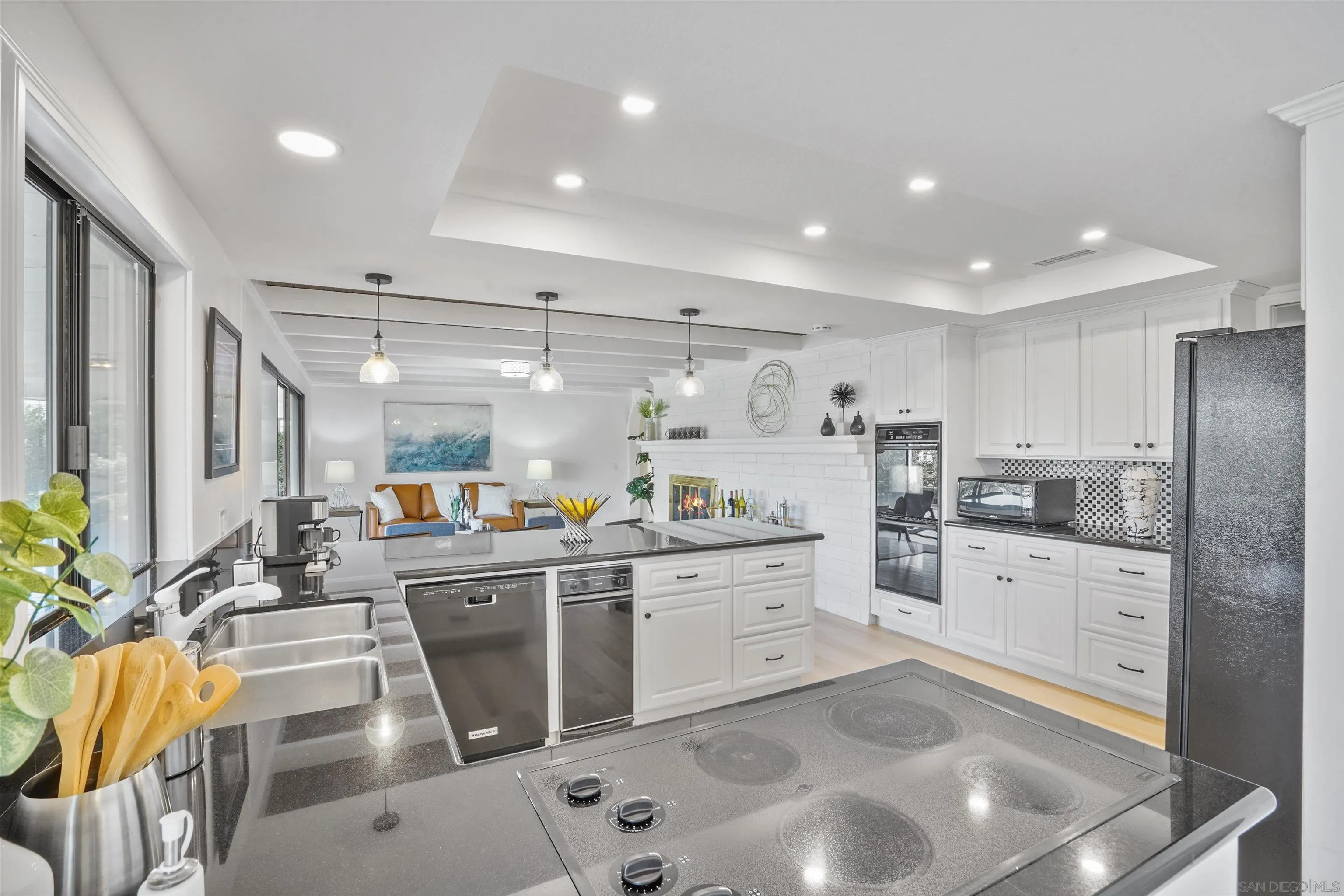 174 Vía De Casa Fallbrook, CA 92028 - Photo 12 of 47 a kitchen with stainless steel appliances kitchen island granite countertop a sink and cabinets