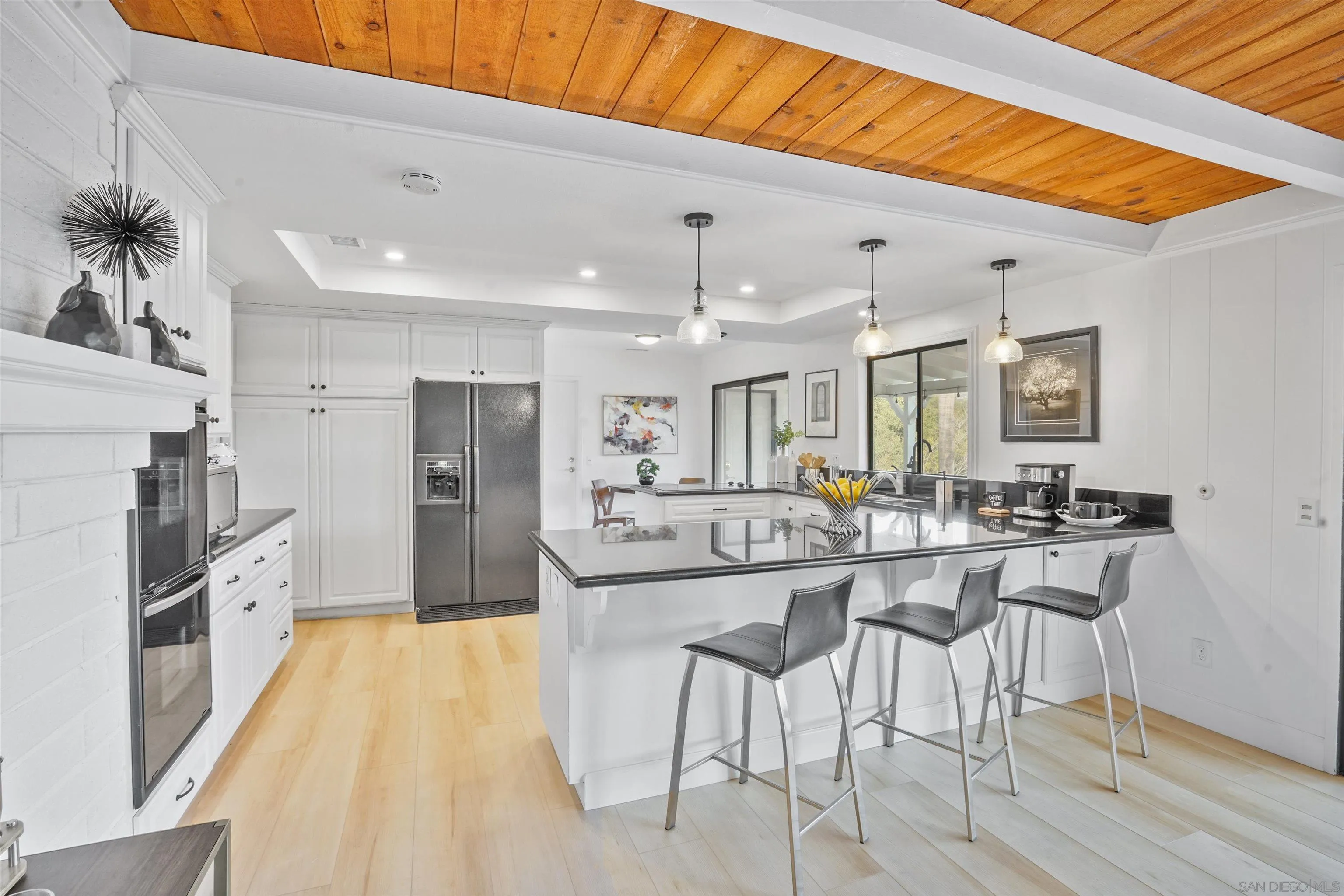 174 Vía De Casa Fallbrook, CA 92028 - Photo 14 of 47 a kitchen with stainless steel appliances granite countertop a sink and a refrigerator