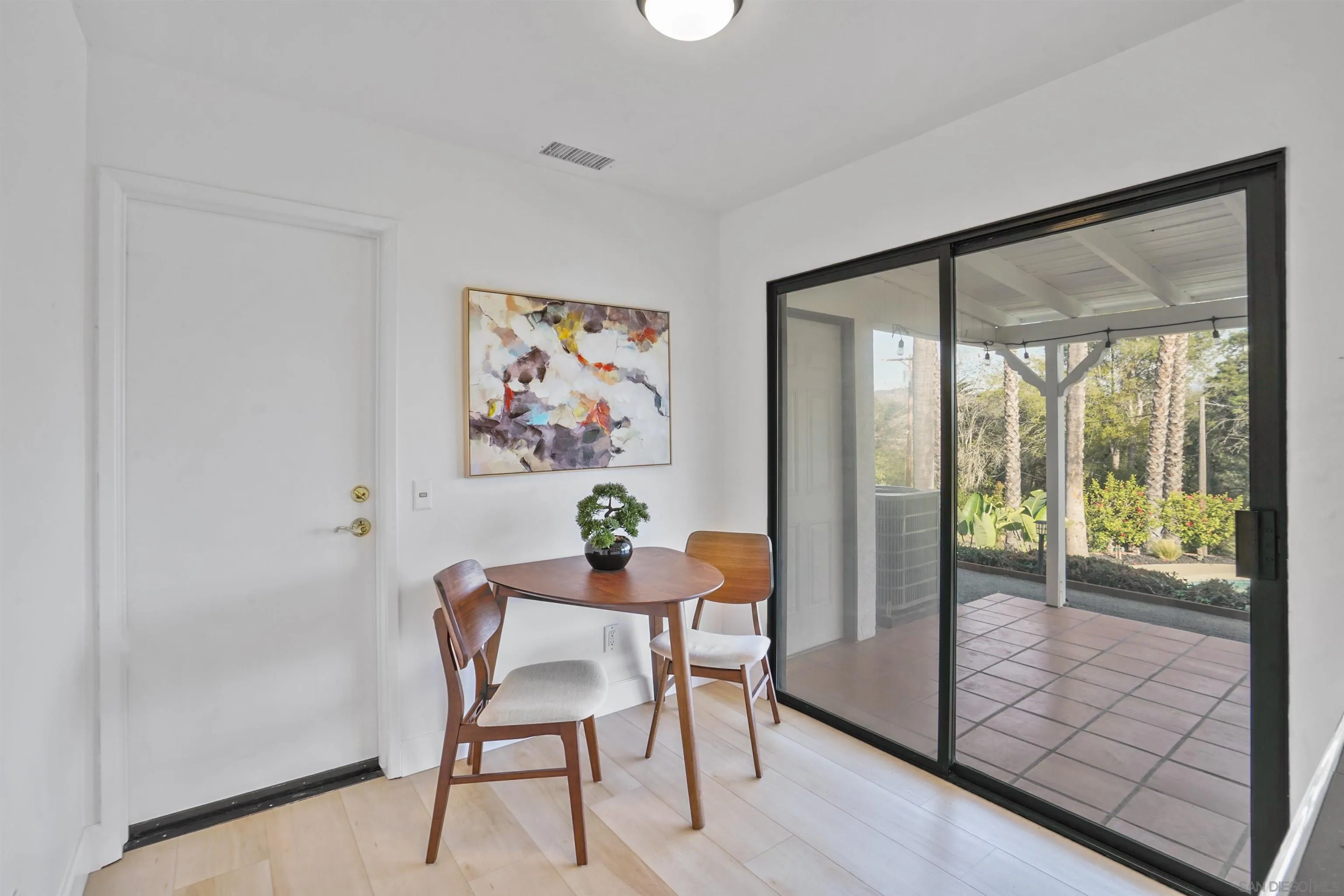 174 Vía De Casa Fallbrook, CA 92028 - Photo 19 of 47 a workspace with furniture and a painting on the wall