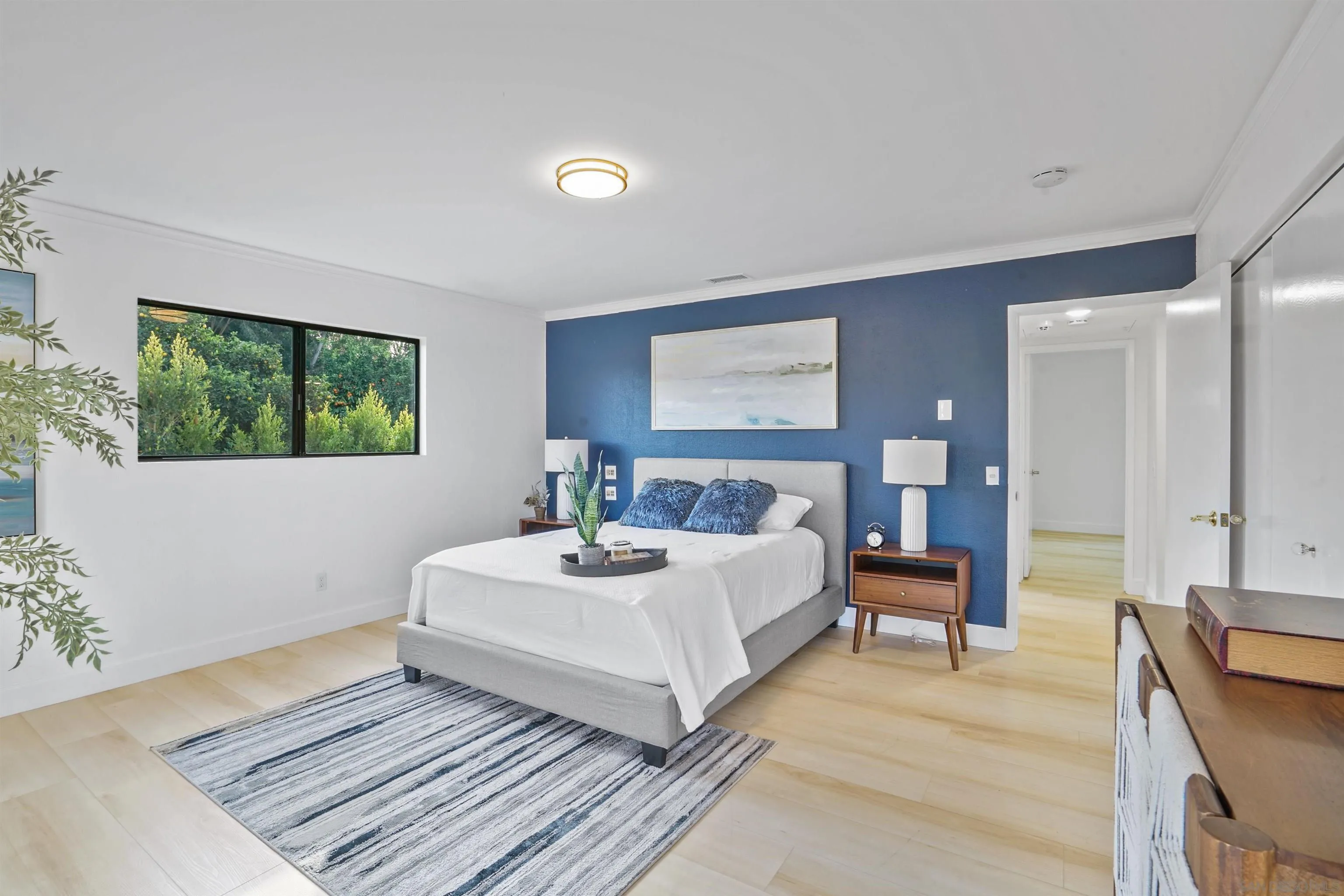 174 Vía De Casa Fallbrook, CA 92028 - Photo 22 of 47 a bedroom with a bed and a large window