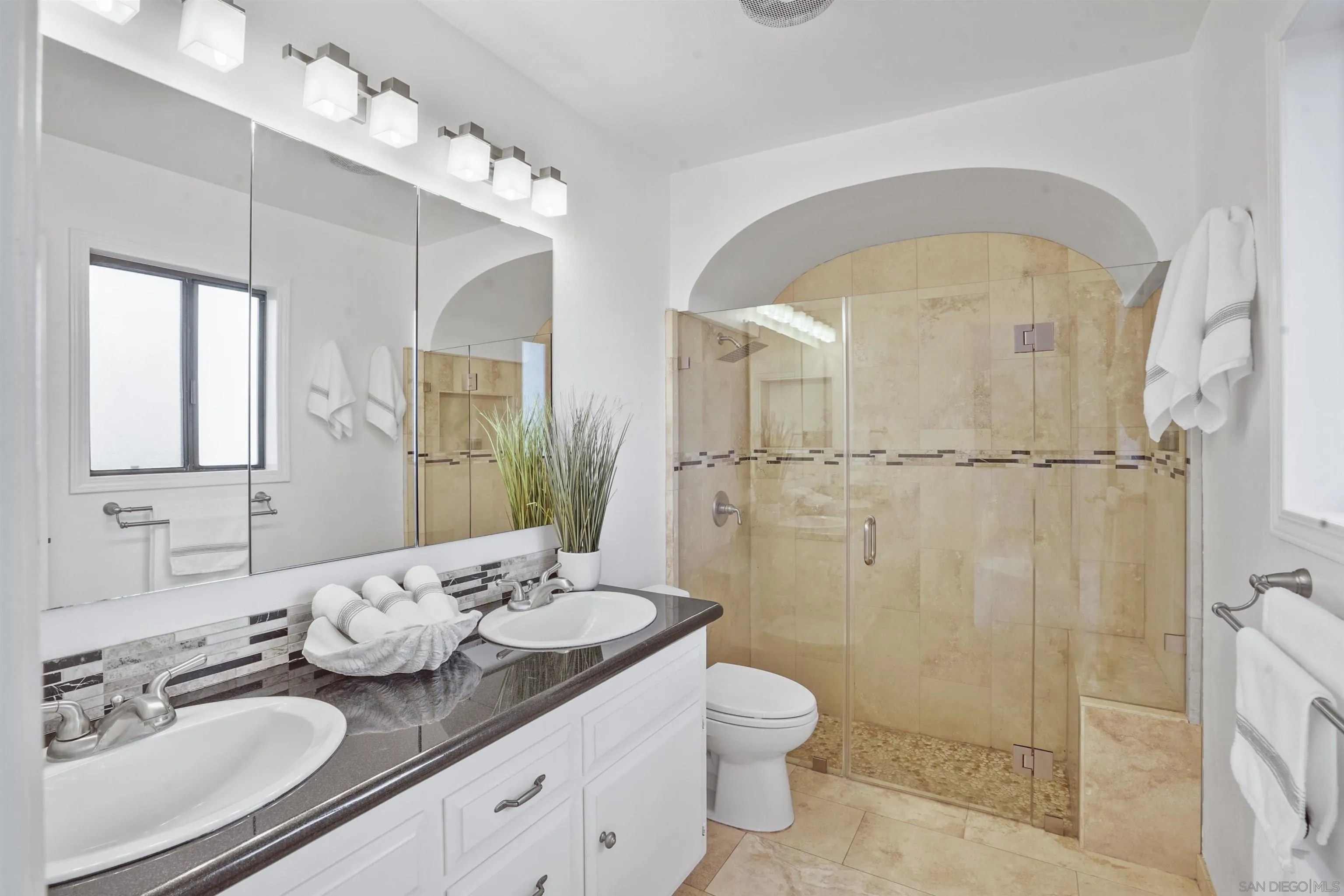 174 Vía De Casa Fallbrook, CA 92028 - Photo 26 of 47 a bathroom with a granite countertop sink mirror vanity and toilet