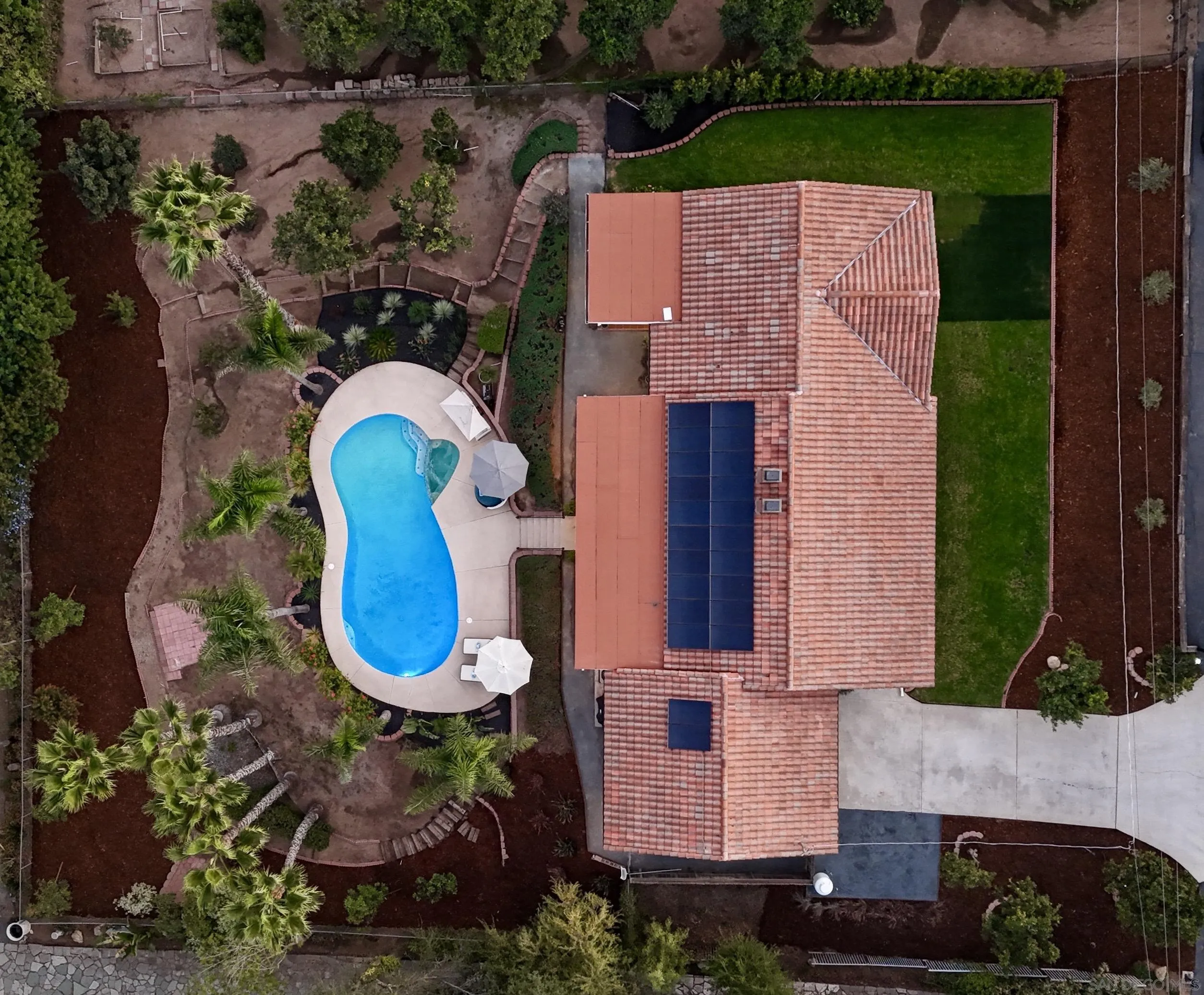 174 Vía De Casa Fallbrook, CA 92028 - Photo 3 of 47 an aerial view of a house with swimming pool and large trees