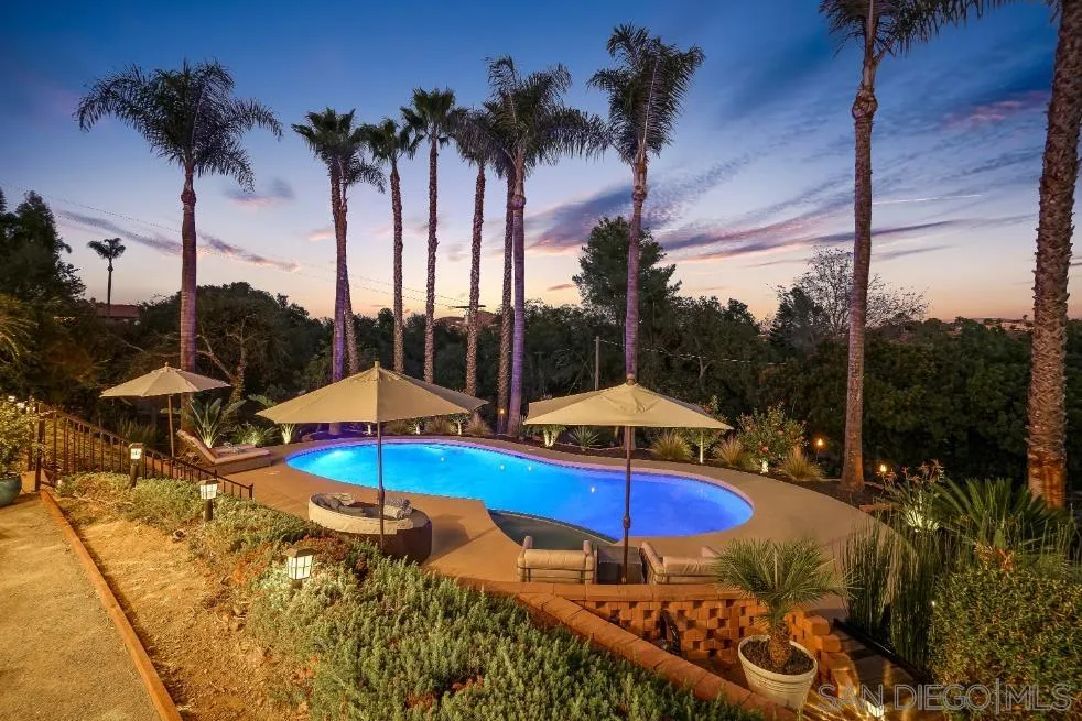 174 Vía De Casa Fallbrook, CA 92028 - Photo 44 of 47 a view of a swimming pool with a table and chairs