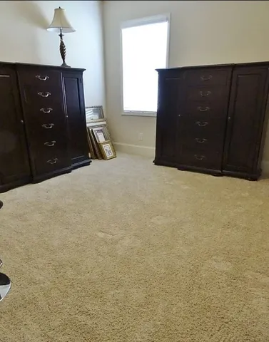 a bed room with a bed and dresser