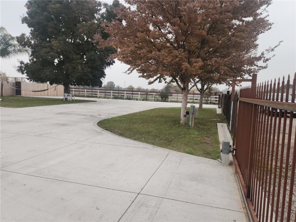5348 Gatson Street Bakersfield, CA 93314 - Photo 2 of 33 a swimming pool with outdoor seating and yard