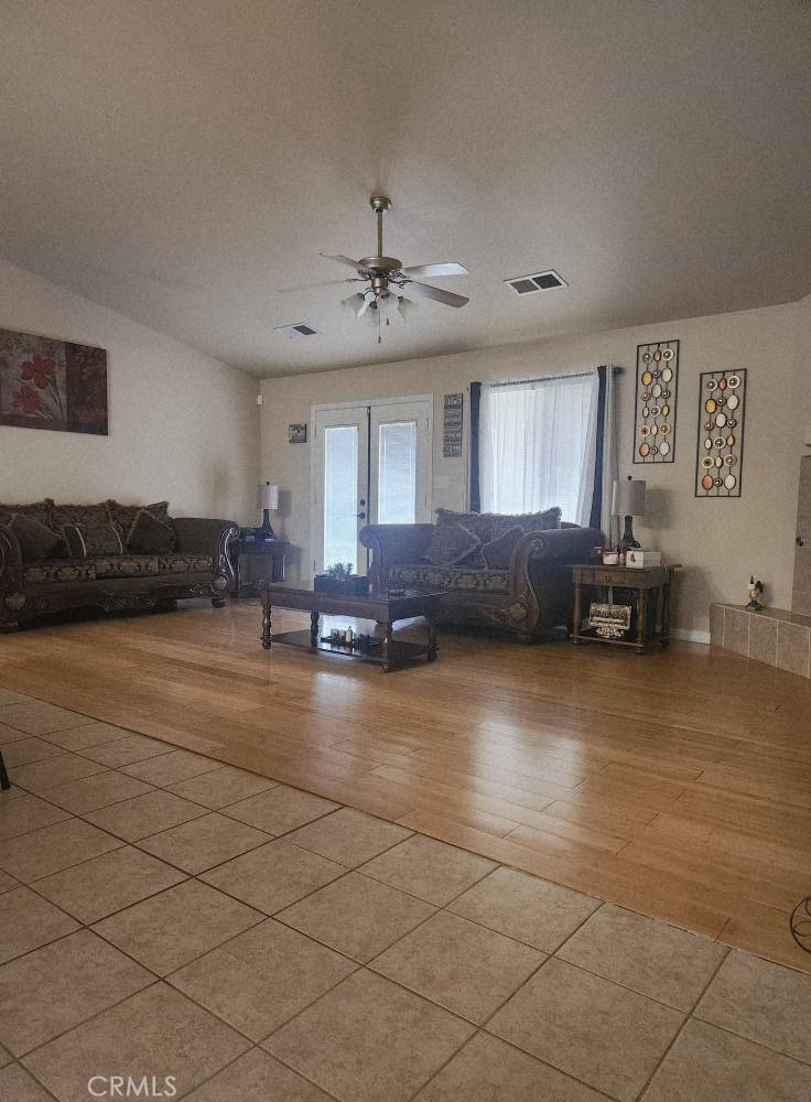 5348 Gatson Street Bakersfield, CA 93314 - Photo 7 of 33 a living room with furniture and kitchen view