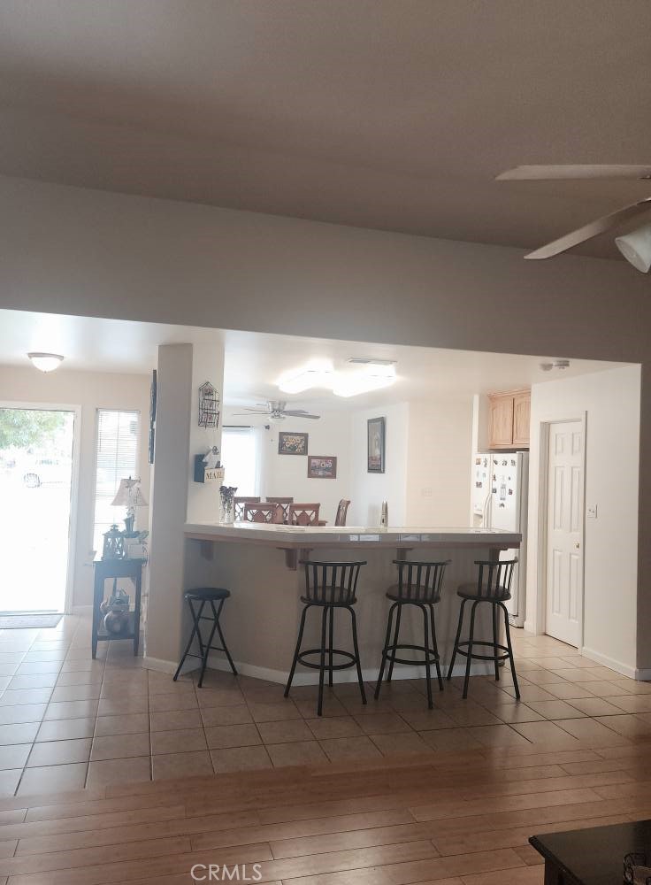 5348 Gatson Street Bakersfield, CA 93314 - Photo 8 of 33 a view of a dining room with furniture and wooden floor