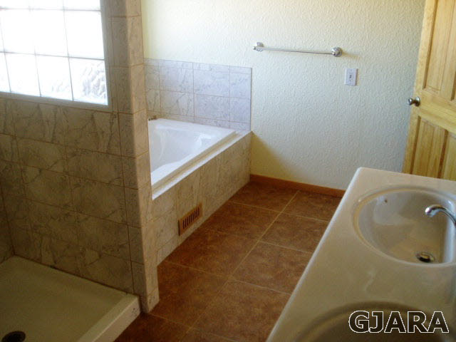 813 21 Road Fruita, CO 81521 - Photo 7 of 10 a bathroom with a tub and shower