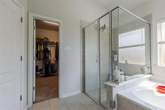 a bathroom with a sink a mirror and a shower