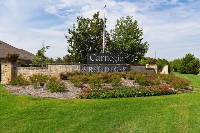 a view of garden with flowers and trees