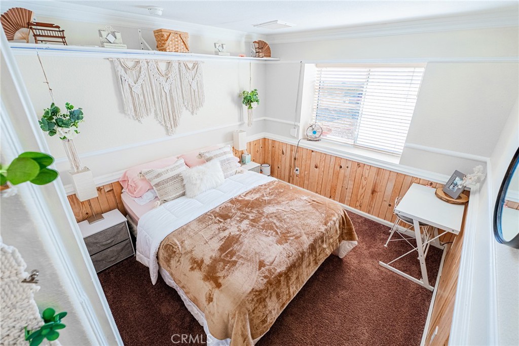 61070 Esparta Avenue Whitewater, CA 92282 - Photo 6 of 10 a bedroom with a bed and a table in it